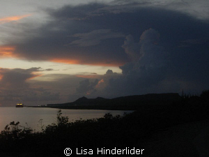 A look at the night sky as it comes rumbling in after a l... by Lisa Hinderlider 